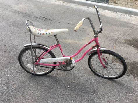 a pink Schwinn bike with a banana seat, much like the one the author had as a child. This photo lacks the handlebar streamers, alas