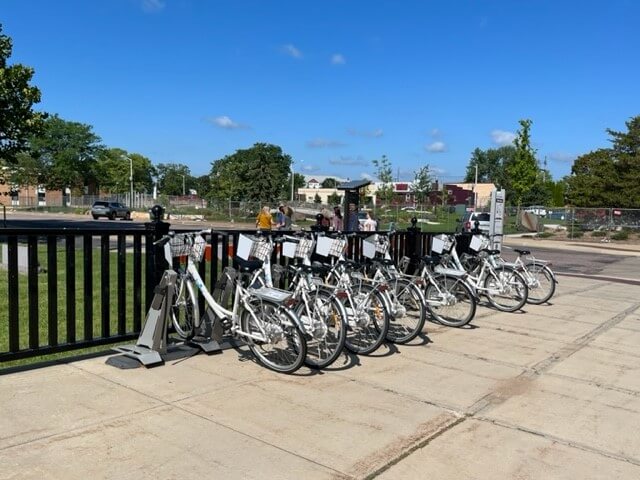 dock of e-bicycles along the river
