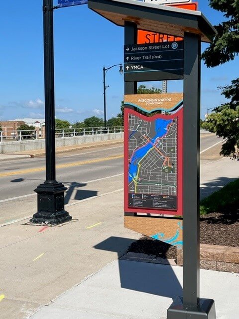 Wayfinding sign showing Wisconsin Rapids downtown area and multi-use trails. These signs are posted in various locations throughout the city.